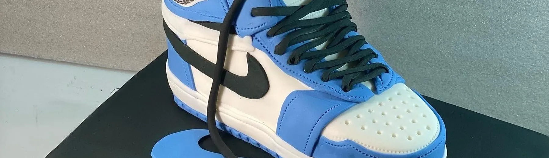 Sculpted blue and white Nike Air Jordan sneaker cake