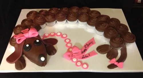 Dachshund pull-apart cupcake cake with a pink bow