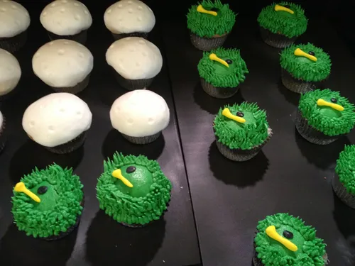 Golf cupcakes with grass frosting, tees and golf ball tops