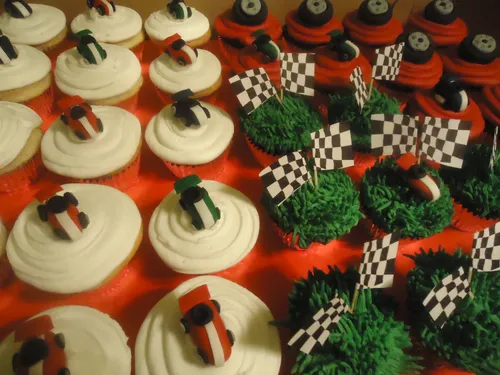 Race car cupcakes with fondant cars and checkered flags