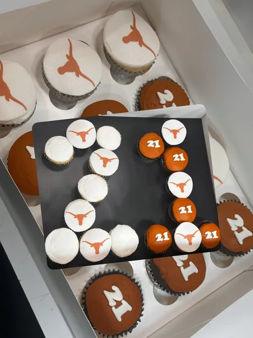Texas Longhorns 21st birthday cupcakes arranged in the number 21