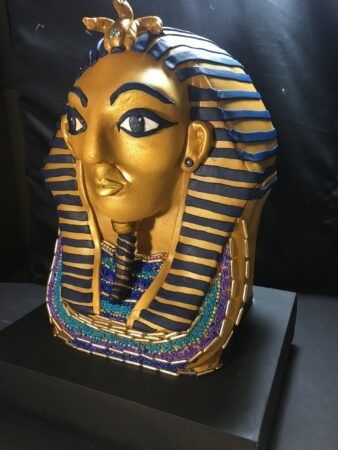 Sculpted gold and blue Egyptian pharaoh mask cake